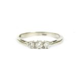 A 9ct white gold three stone brilliant cut diamond ring, finger size M1.62g