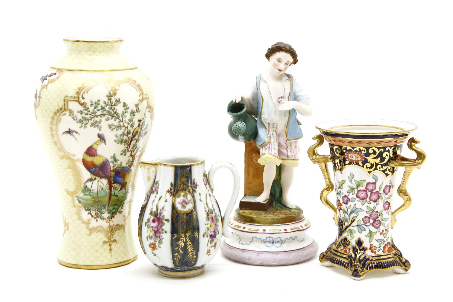 Decorative ceramics: two pairs of china figures, further figures, vases, box, jugs, etc