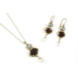 A 9ct gold garnet blue topaz and cultured freshwater pearl pendant and earring suite. A circular