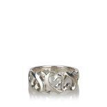 A sterling silver Tiffany Loving Heart ring, with interlocking open hearts to plain polished band,