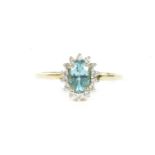 A 9ct gold oval cut apatite and white stone cluster ring, finger size R½,2.20g