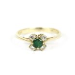 A gold circular emerald cut ring with four diamonds,1.94g