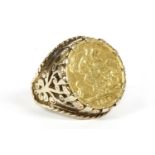 A 1910 half sovereign ring, claw set to a gold ring mount, marked 9ct, size O, 12.35g