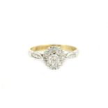 An 18ct gold illusion set diamond cluster ring, size L½3.18g