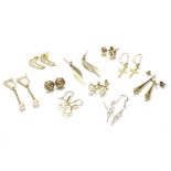 A collection of gold earrings, to include a pair of gold hollow tapering earrings tested as 9ct
