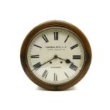 A mahogany wall clock, by Camerer Kuss, with two train movement striking on a gong, with 12in