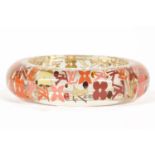 A Louis Vuitton monogram inclusion GM bangle, transparent resin band embedded with LV monogram,