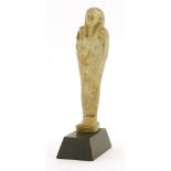 An Egyptian ushabti figure, 26th Dynasty, 14.5cmon a later stand, 17cm overall