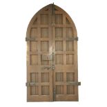 A pair of Victorian oak church doors, in Gothic style, of framed construction, with original iron