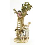 A Meissen fruit-picking group,late 19th century, modelled as a young boy collecting apples, on a