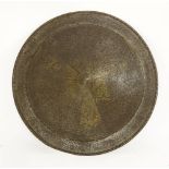 A circular shield or dhal, Indian or Persian, engraved and part gilded, 56cm diameter