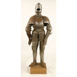 An engraved suit of armour,late 19th/early20th century, on a wooden stand,170cm high overall