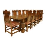 An oak refectory table and twelve chairs,second half 20th century, the table with a plank top and