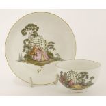 A Meissen cup and saucer, one painted with a couple, the other with three figures in arbours, blue