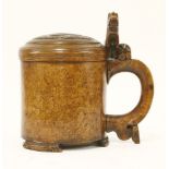 A Norwegian Karelian birch peg tankard, 18th century, with lion thumbpiece and carved rampant lion