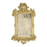 A French gilt mirror,18th century, with a scrolling frame,64cm wide90.5cm high