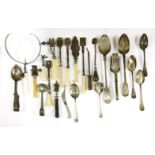 A collection of unusual utensils,19th century and later, including moustache spoons, separating