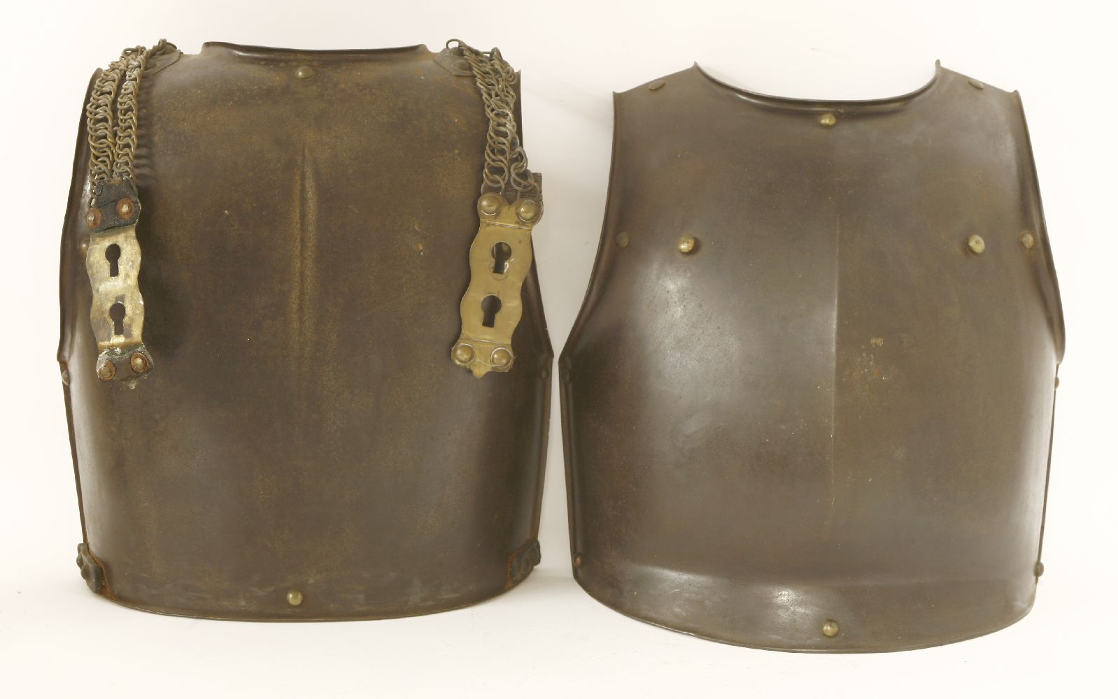 An armour breast and backplate, 18th century, probably English, with chain shoulder straps,44cm high