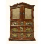 A South West German miniature cabinet,late 18th century, in cherry wood and apple wood, with
