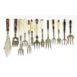 Eleven Victorian and later toasting forks,and a pair of Victorian silver-plated fish servers, with