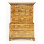 A George II walnut chest on chest,the moulded and dentil cornice over two short and five long