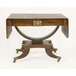 A Regency period rosewood sofa table,with inlaid brass banding and two frieze drawers, on a half