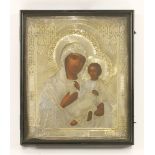 A Russian Madonna and child icon,with a silver oklad, stamped marks 1883/84 standard,27cm wide31cm