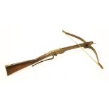 A wooden and iron crossbow, early 19th century,90cm long72cm wide, anda cranequin or goat's foot