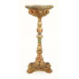 A carved and gilt painted torchère,late 19th century, the shaped top over a carved stand,31cm