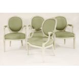 A set of four Louis XVl-style fauteuils, painted white, with oval backs,60cm wide70cm deep93cm