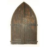 A pair of Victorian oak church doors, in Gothic reform style, of ledge and brace construction,