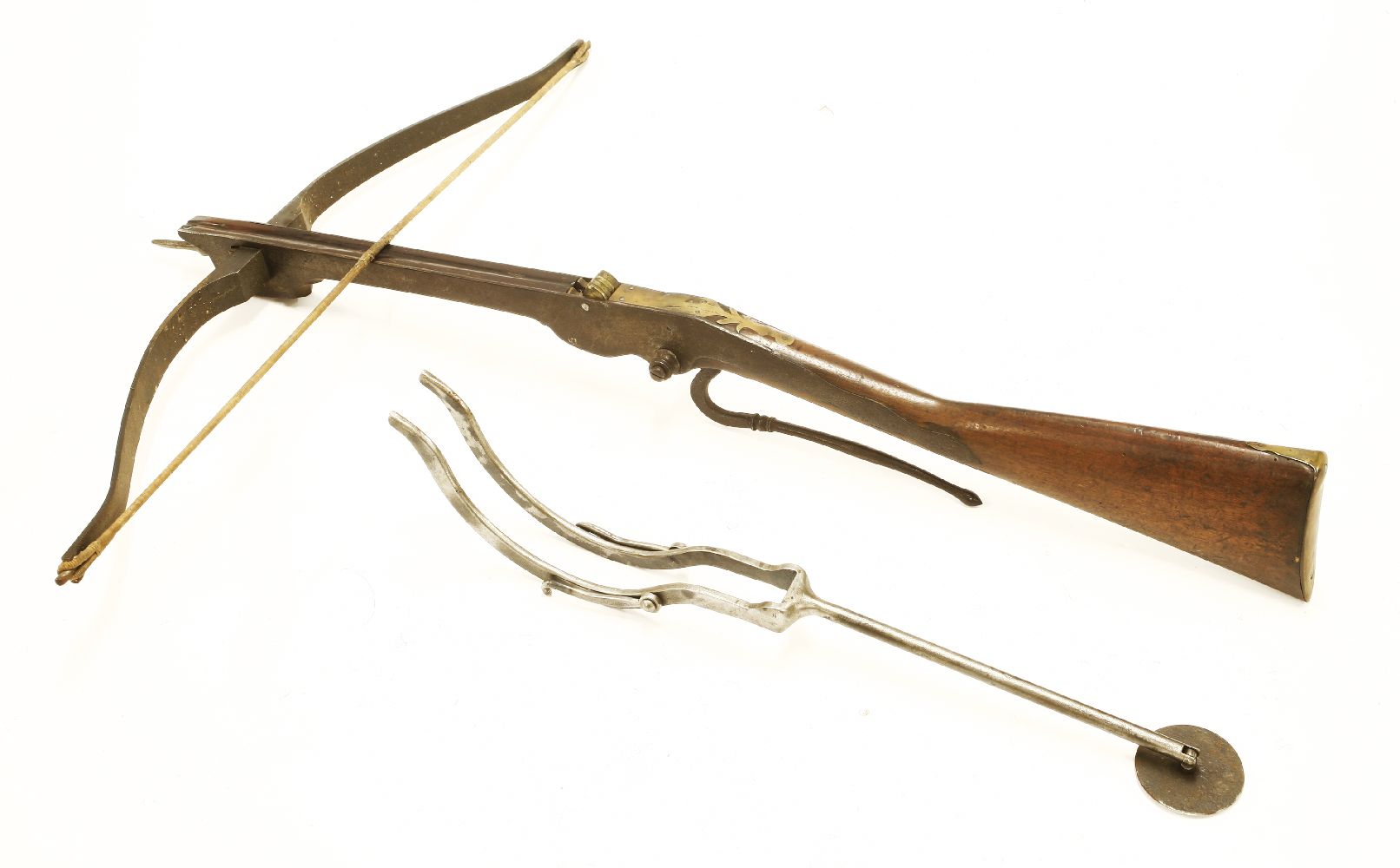 A wooden and iron crossbow, early 19th century,90cm long72cm wide, anda cranequin or goat's foot - Image 2 of 3