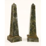 A pair of variegated green marble obelisks,with a gilt metal frieze and on a square base,101cm