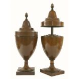 A pair of Adam design inlaid mahogany cutlery boxes,each of urn form and raised on plinth bases, the