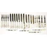 Twenty-four porcelain-handled cutlery items,comprising: eleven knives and thirteen forks, mainly