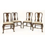 A pair of George II mahogany dining chairs,each with a solid baluster back splat, over a drop-in