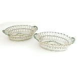 A pair of tin-glazed earthenware chestnut baskets,19th century, of oval shape with pierced sides and