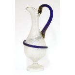 A Victorian glass ewer,with a crackled glazed moulded body, with an entwined circle forming the