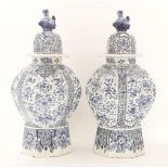 A pair of Dutch delft octagonal baluster vases and covers,19th century, in the oriental manner,