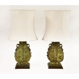 A pair of bronze lamps,20th century, modelled as Chinese archaic vases, mounted on mahogany