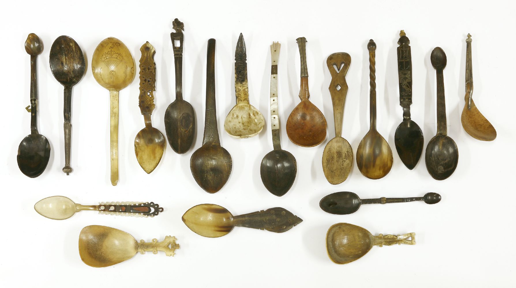 A collection of treen and horn spoons,17th century and later, including folding examples (19)