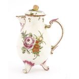 A Ludwigsburg porcelain jug and cover,c,1760, decorated with floral sprays and raised on three