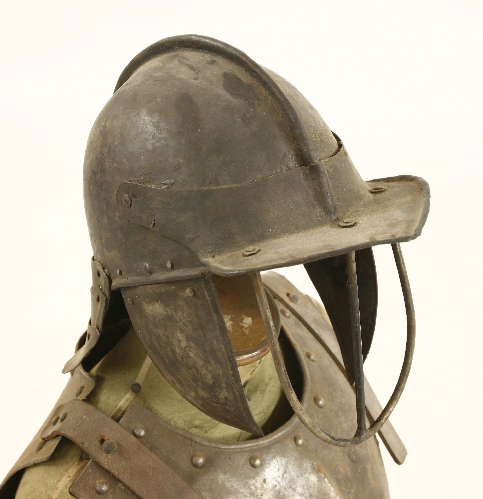 Cromwellian armour,a lobster tail helmet, with hinged face guard, breast and backplates, on a - Image 3 of 3