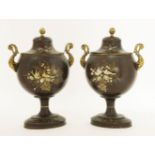A pair of painted tin urns and covers,19th century, each with a pair of gilt handles and japanned