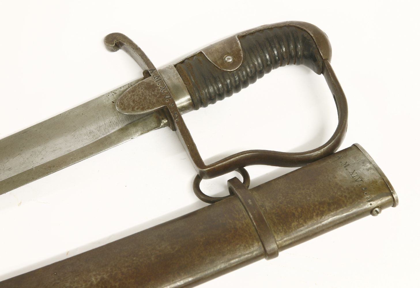 A Prussian cavalry sword and scabbard,hilt and scabbard impressed 'A.M. XlV. 5. 33',99cm long (2) - Image 3 of 3