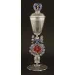 A façon de Venise winged wine glass and cover,20th century, the domed cover with a coloured scrolled