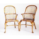 A pair of modern elm and ash high back Windsor chairs,with saddle-shaped seats, cabriole front