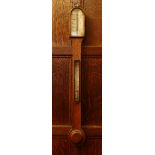 A Victorian mahogany stick barometer,the arched top with an ivory register over a silvered