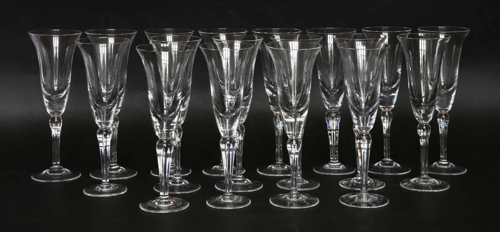 A set of eighteen modern champagne flutes, 24cm high (18)