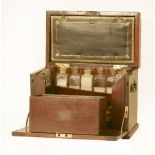 A large mahogany apothecary's cabinet,19th century, the hinged lid with brass corners and a plaque